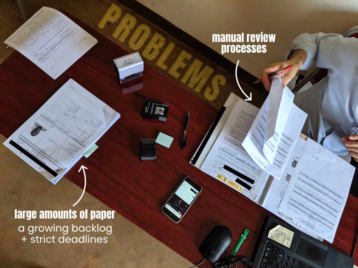 A refugee officer preparing documents for an interview.